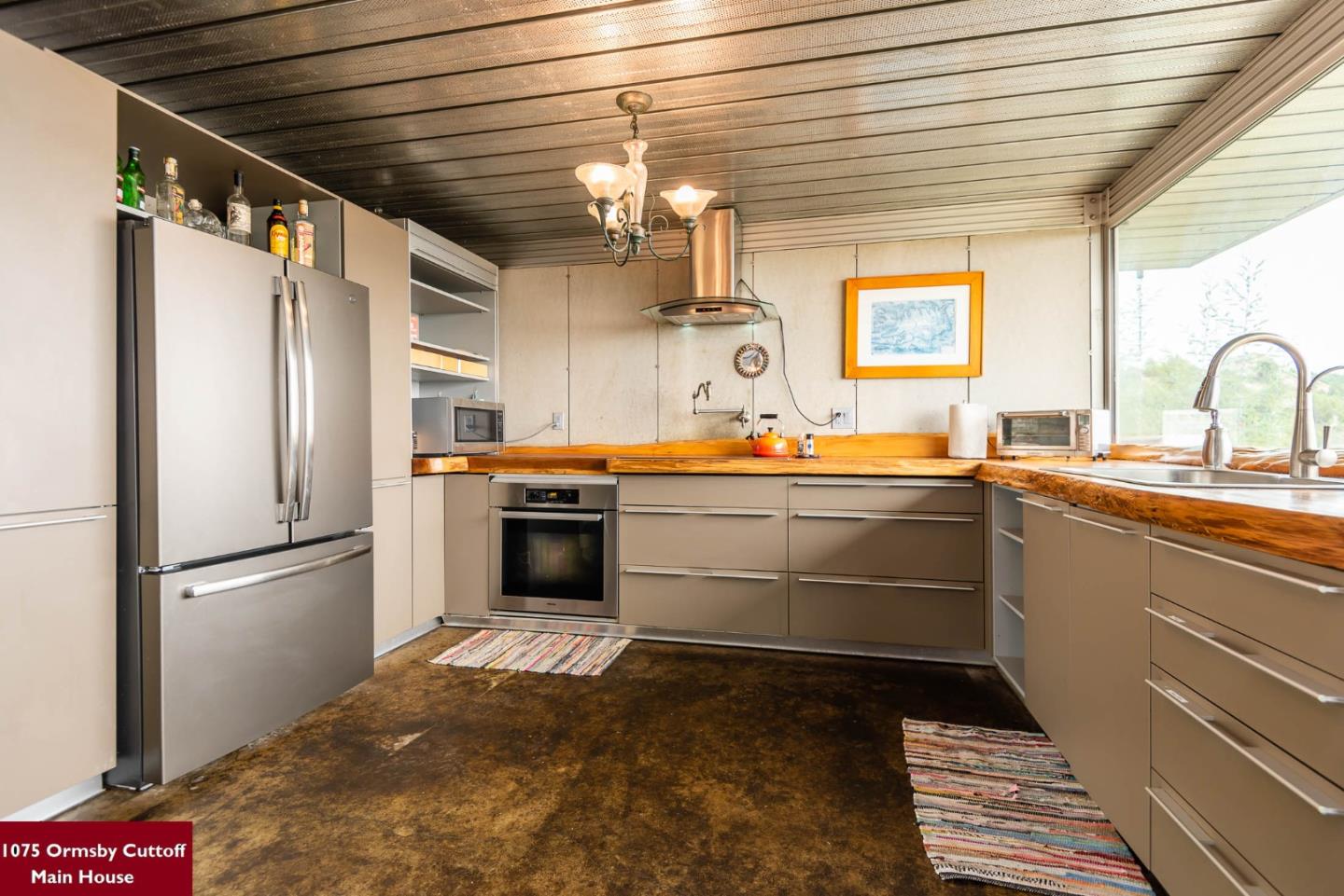 1075 Ormsby Cutoff Watsonville, CA 95076 - Photo 11 of 30 a kitchen with a sink and refrigerator