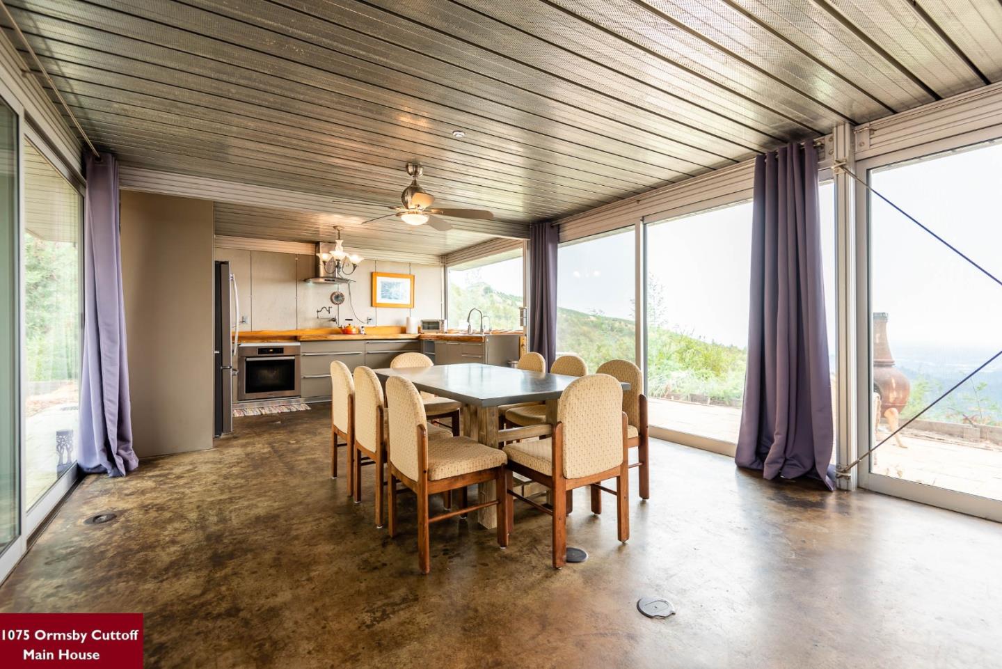 1075 Ormsby Cutoff Watsonville, CA 95076 - Photo 13 of 30 a dining room with furniture and wooden floor