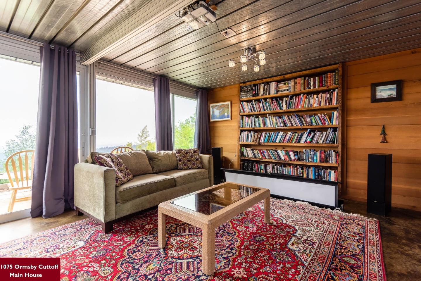 1075 Ormsby Cutoff Watsonville, CA 95076 - Photo 14 of 30 a living room with furniture and a book shelf