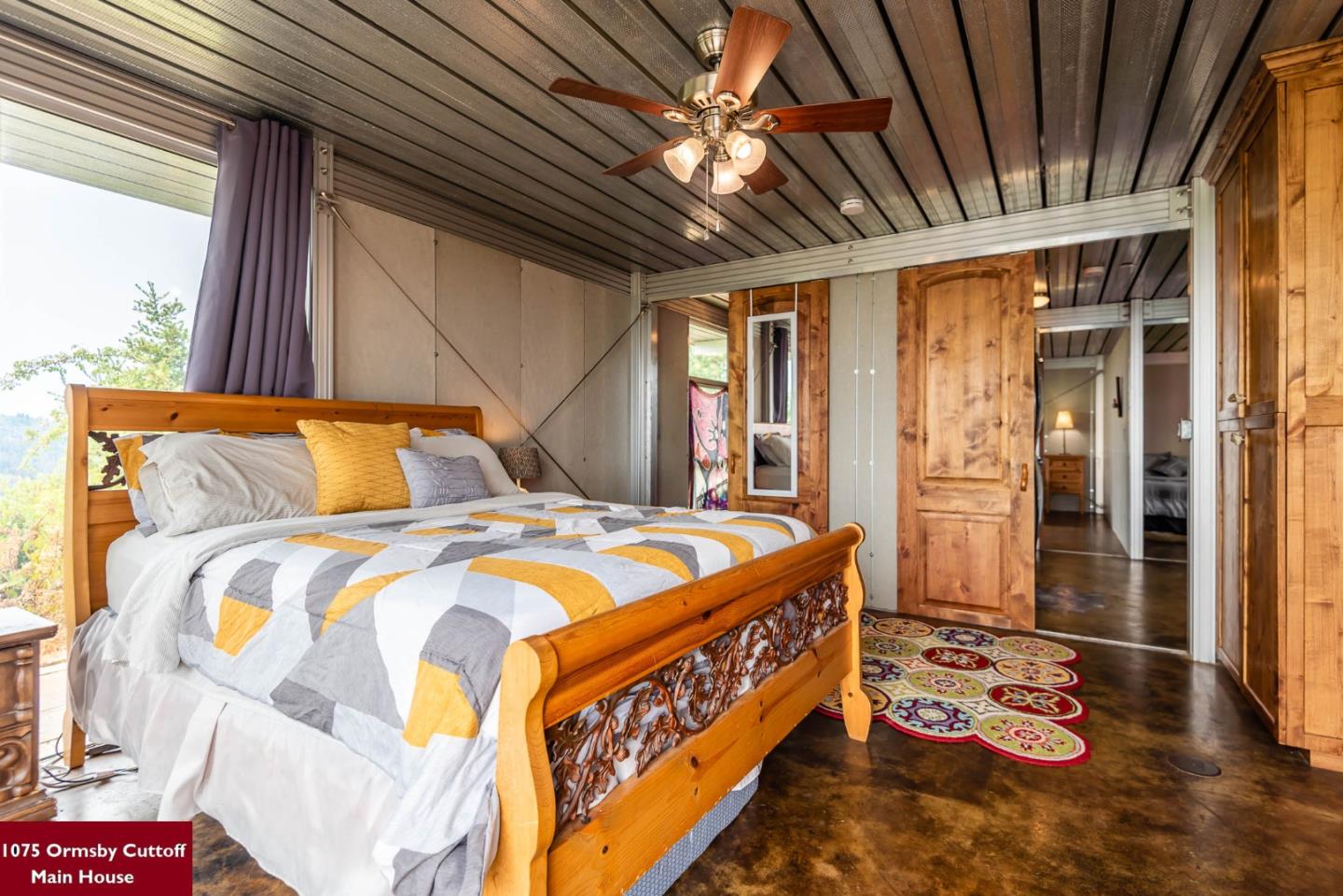 1075 Ormsby Cutoff Watsonville, CA 95076 - Photo 16 of 30 a bedroom with a bed a dresser next to a window