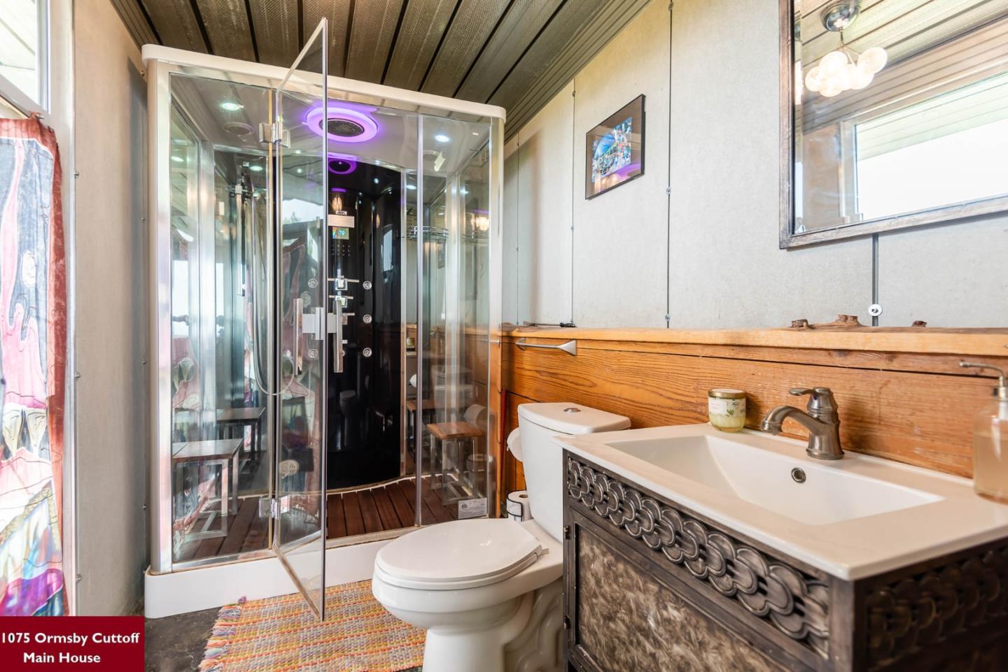 1075 Ormsby Cutoff Watsonville, CA 95076 - Photo 17 of 30 a bathroom with a sink a toilet and shower