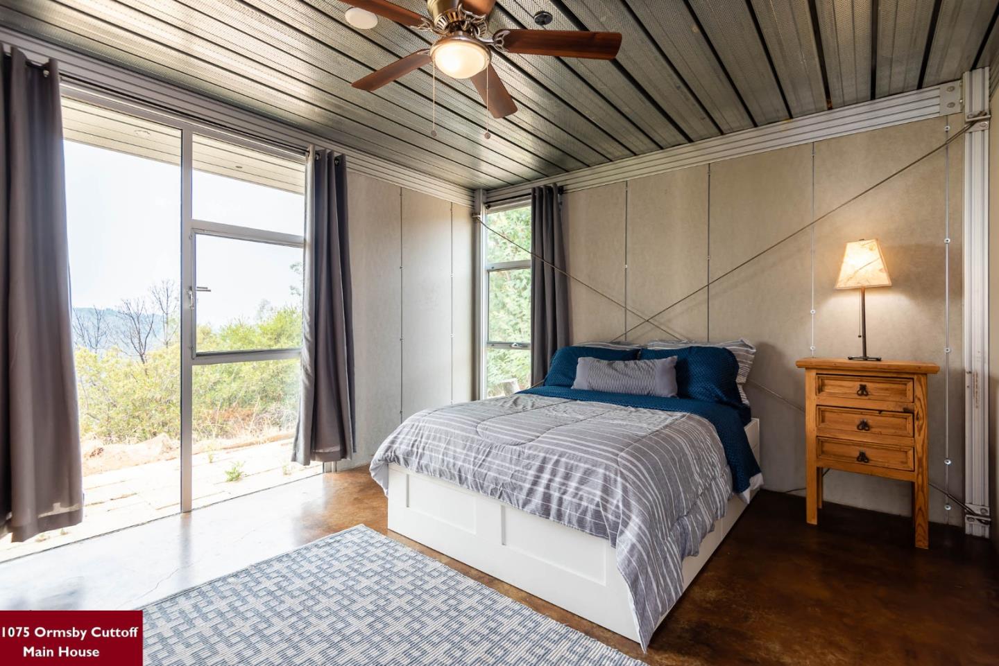 1075 Ormsby Cutoff Watsonville, CA 95076 - Photo 19 of 30 a bedroom with a bed and a large window with balcony view