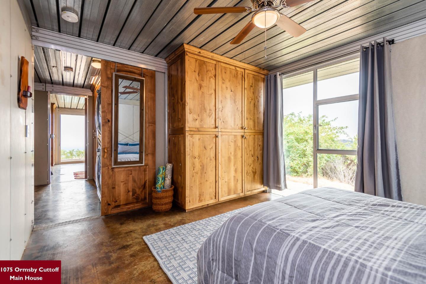 1075 Ormsby Cutoff Watsonville, CA 95076 - Photo 20 of 30 a bedroom with a bed and wooden floor