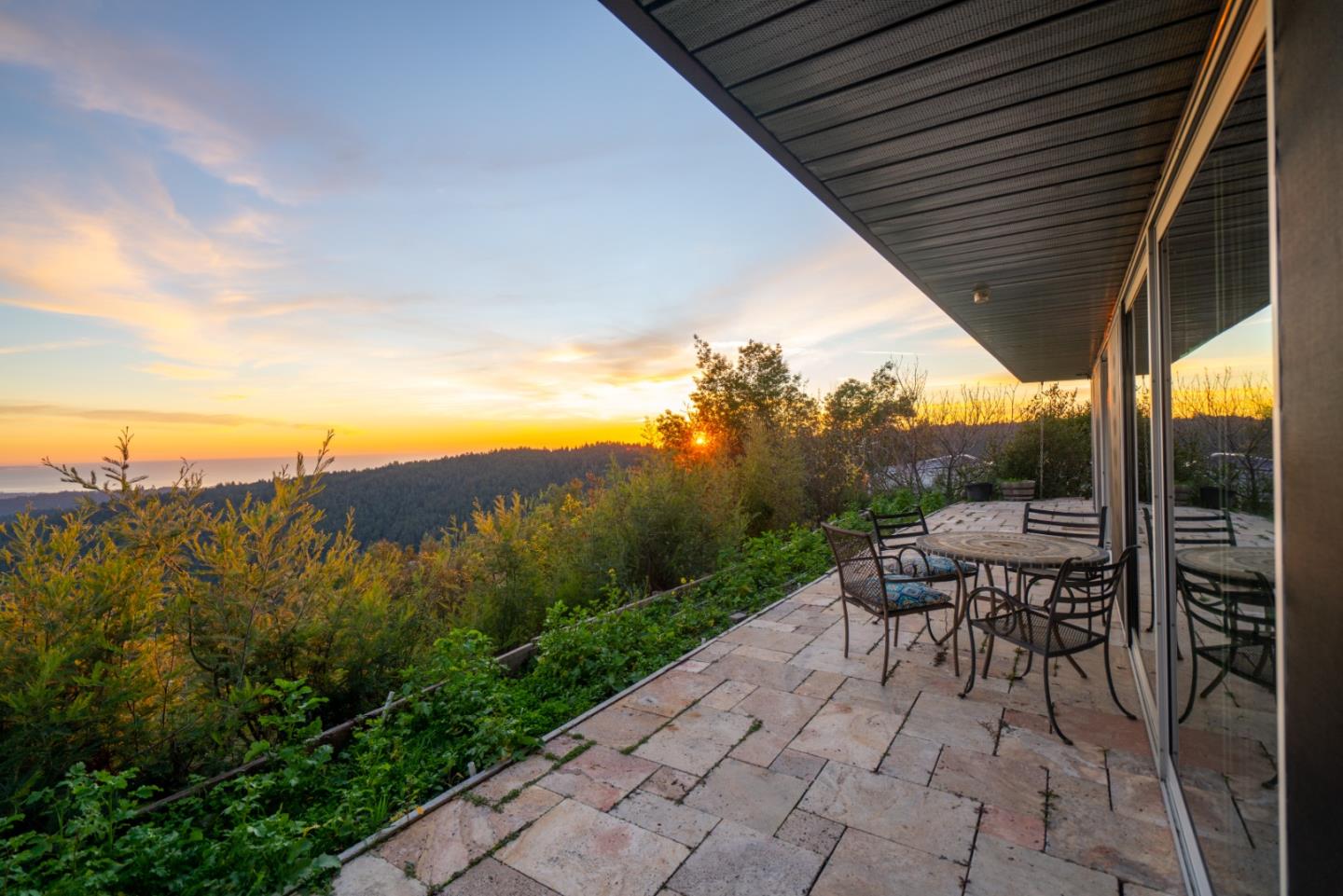1075 Ormsby Cutoff Watsonville, CA 95076 - Photo 23 of 30 a view of a patio with a table and chairs under an umbrella