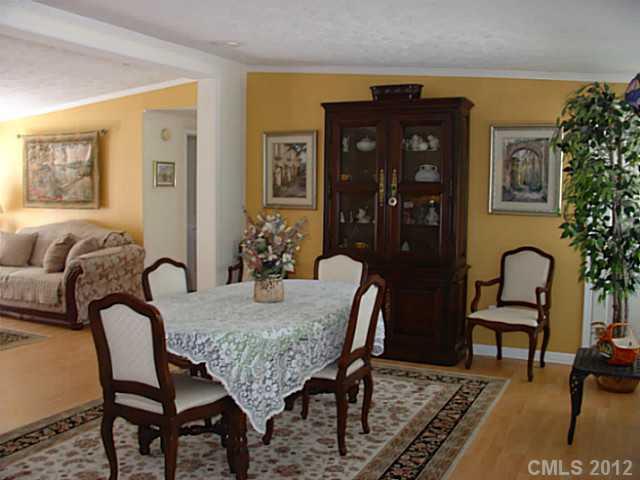 8109 Pine Oak Road Waxhaw, NC 28173 - Photo 2 of 16 a dining room with furniture and window