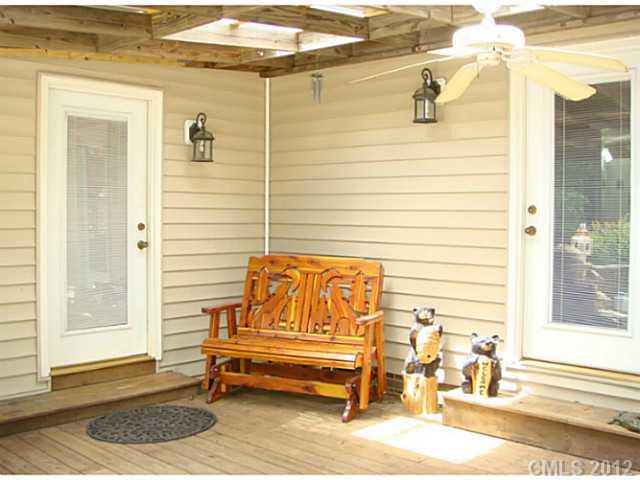 8109 Pine Oak Road Waxhaw, NC 28173 - Photo 14 of 16 a white bench sitting in front of a door
