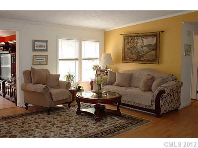8109 Pine Oak Road Waxhaw, NC 28173 - Photo 3 of 16 a living room with furniture a table and a window