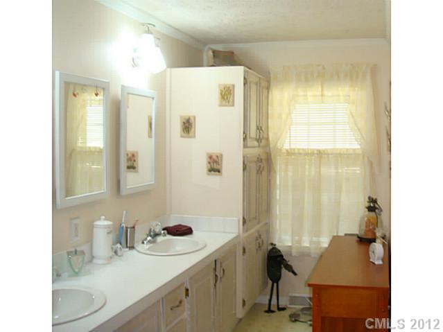 8109 Pine Oak Road Waxhaw, NC 28173 - Photo 7 of 16 a bathroom with a sink double vanity and a shower
