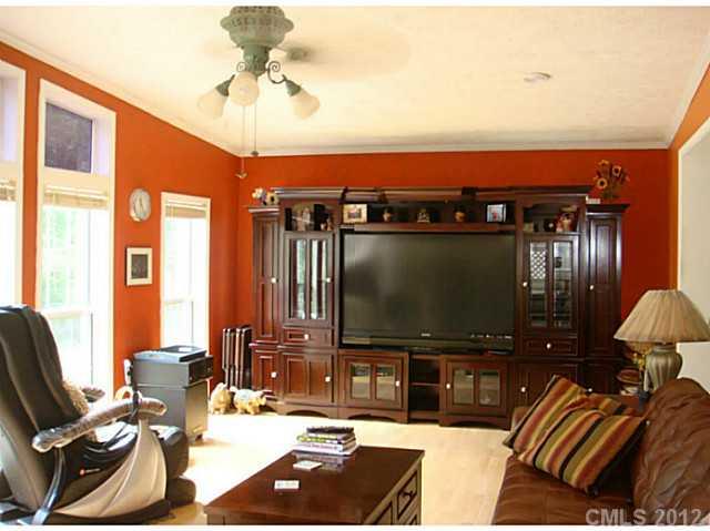8109 Pine Oak Road Waxhaw, NC 28173 - Photo 9 of 16 a living room with furniture and a flat screen tv