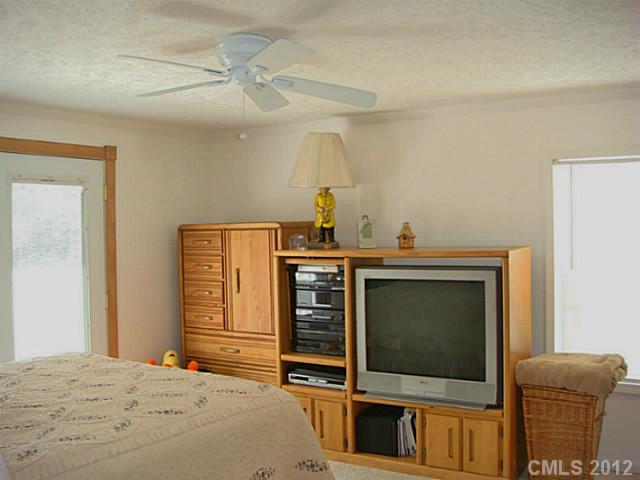 8109 Pine Oak Road Waxhaw, NC 28173 - Photo 10 of 16 a bedroom with a bed and furniture