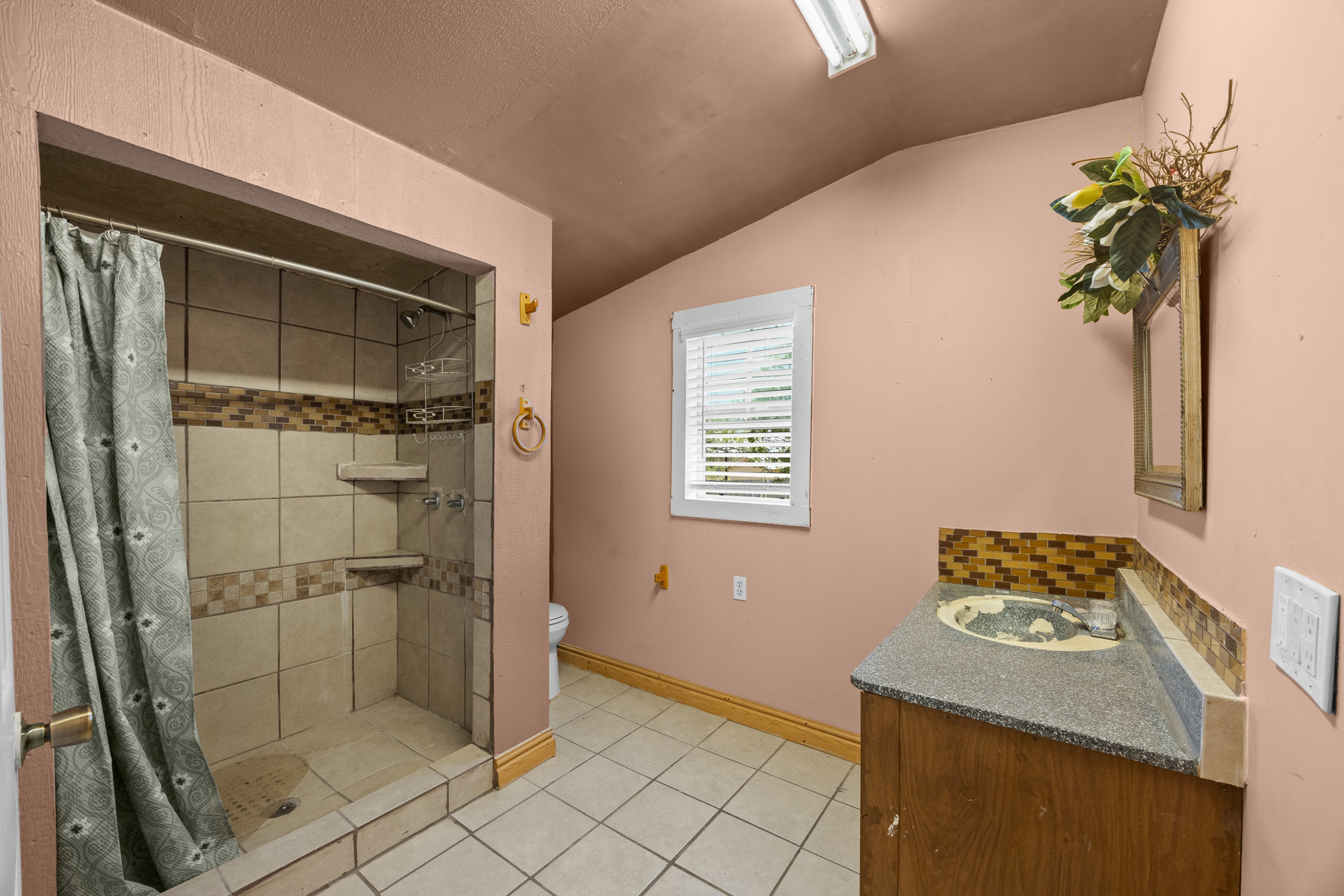 147 Community Center Road Rosanky, TX 78953 - Photo 15 of 33 Full bath with vanity, a stall shower, light tile patterned floors, and lofted ceiling