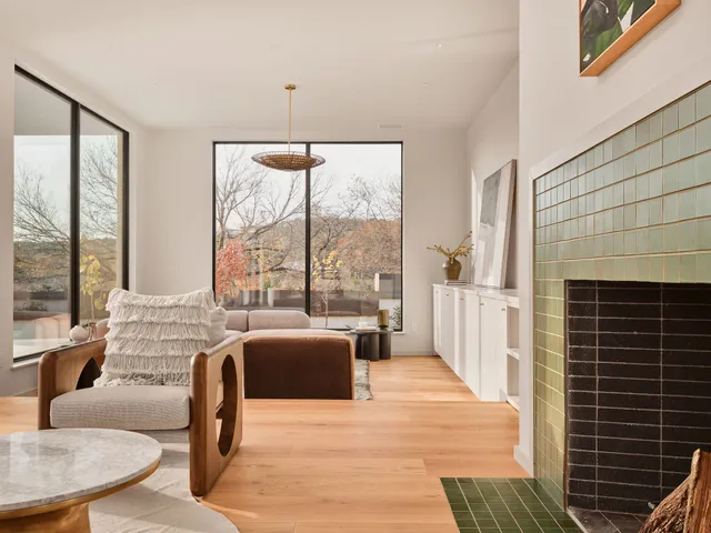 a view of a dining room with furniture and a potted plant