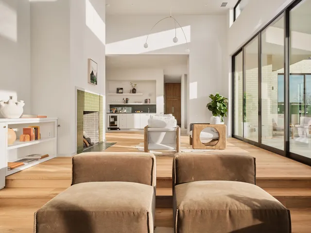 a living room with furniture and a potted plant