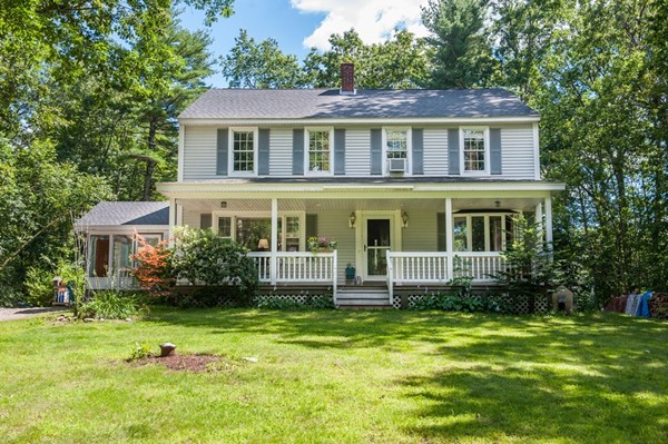 72 Bushy Lane Rutland, MA 01543 - Photo 1 of 29 a front view of a house with a yard table and chairs