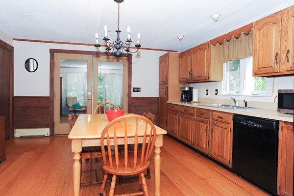 72 Bushy Lane Rutland, MA 01543 - Photo 12 of 29 a kitchen with stainless steel appliances a table and chairs in it