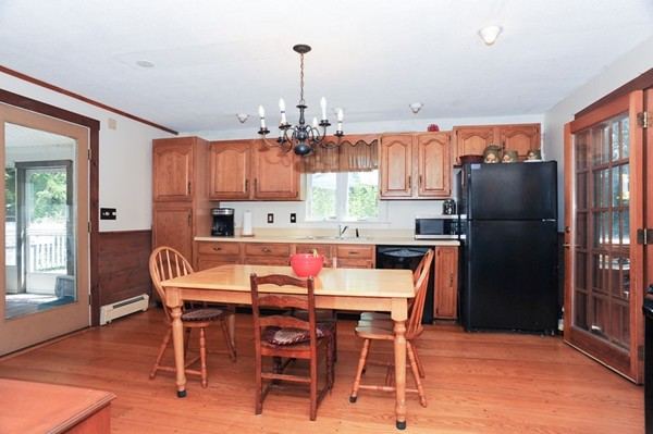72 Bushy Lane Rutland, MA 01543 - Photo 13 of 29 a kitchen with stainless steel appliances granite countertop a dining table and chairs
