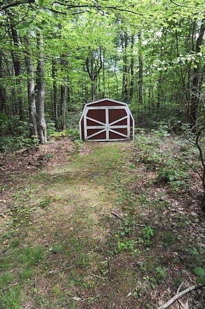 72 Bushy Lane Rutland, MA 01543 - Photo 27 of 29 a view of a tiny house in the forest
