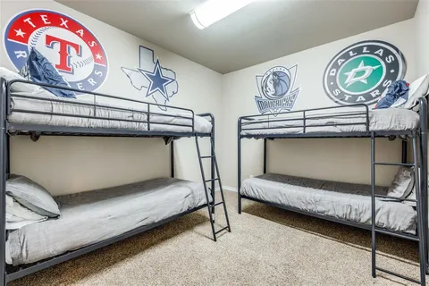 a bedroom with furniture and a air conditioner vent