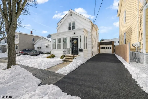 a view of a house with a snow in the background