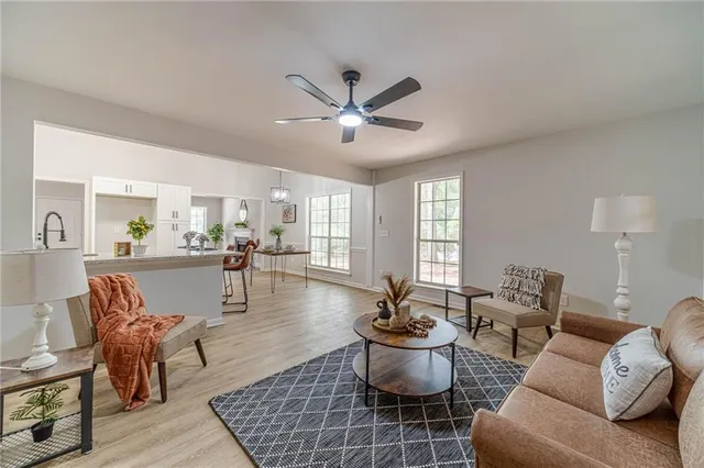a living room with furniture and a rug