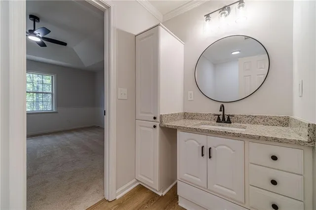 a bathroom with a glass shower door