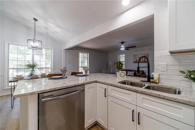 a kitchen with kitchen island a counter space and a sink