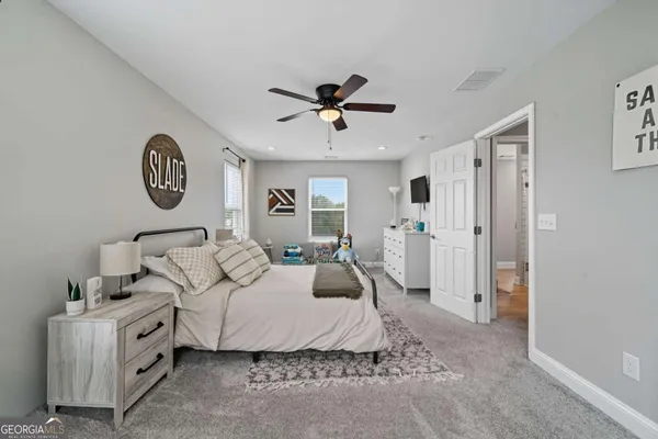 a bedroom with furniture and a chandelier