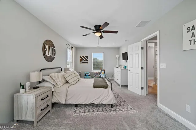 a bedroom with furniture and a chandelier
