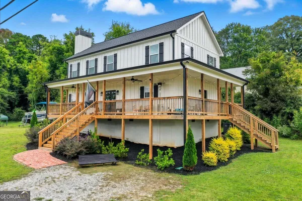 a front view of a house with garden