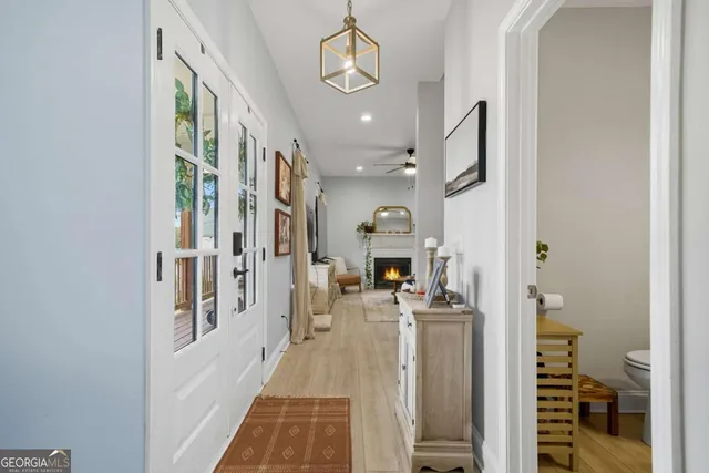 a view of a hallway with dining area and entryway