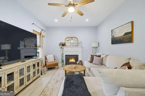a living room with furniture and a fireplace