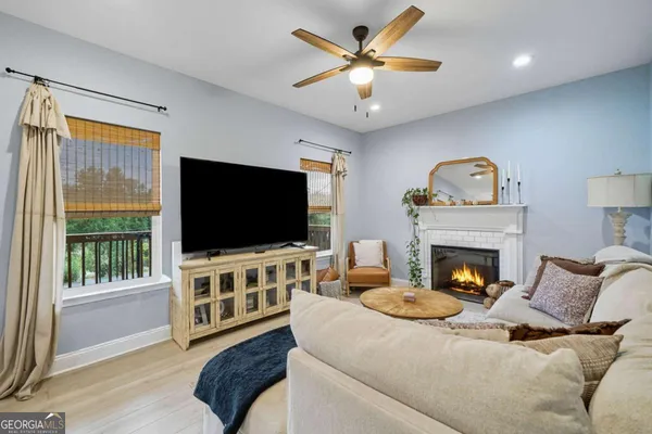 a living room with furniture and a flat screen tv
