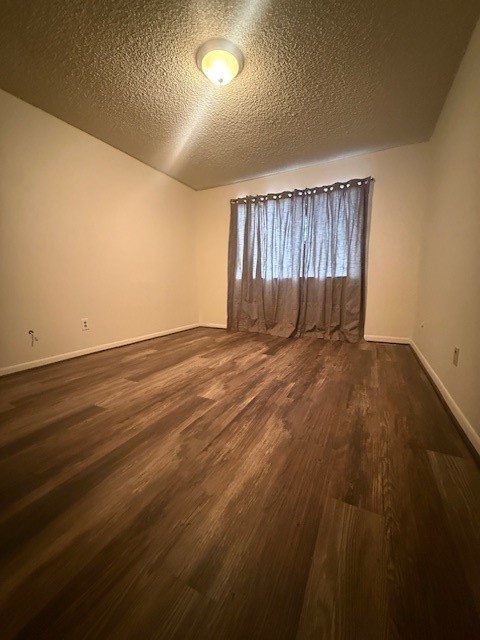 16714 Rockbend Houston, TX 77084 - Photo 15 of 19 an empty room with wooden floor and windows
