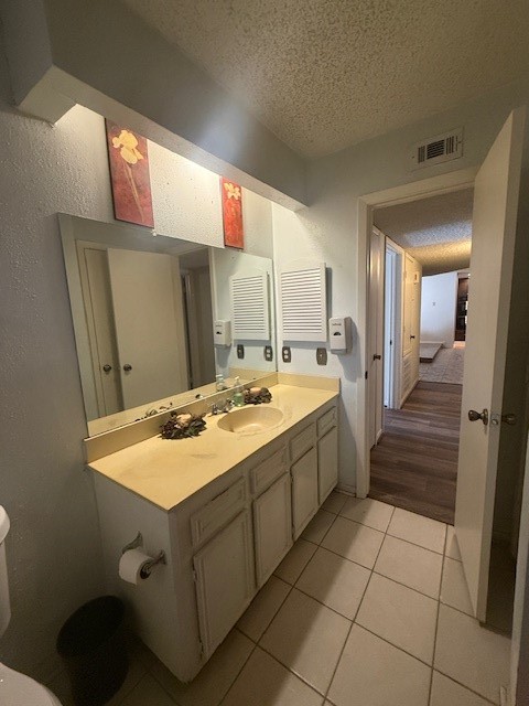16714 Rockbend Houston, TX 77084 - Photo 18 of 19 a bathroom with a sink a mirror and a shower