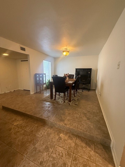 16714 Rockbend Houston, TX 77084 - Photo 4 of 19 a view of a dining room with furniture