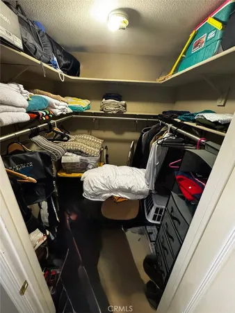 a en suite bathroom with a double vanity sink a mirror and a bathtub
