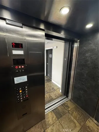 a living room with furniture a rug and a flat screen tv