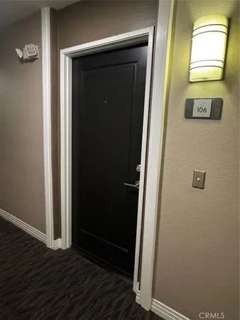 a kitchen with granite countertop a sink and a stove