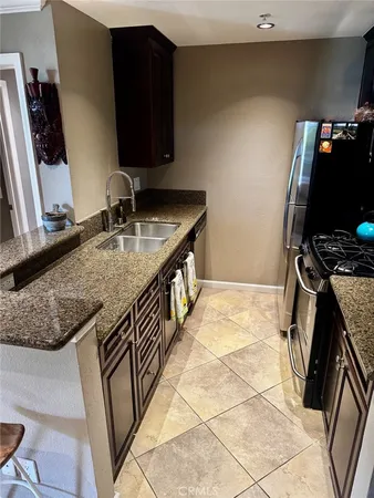 a bedroom with two beds and a flat screen tv