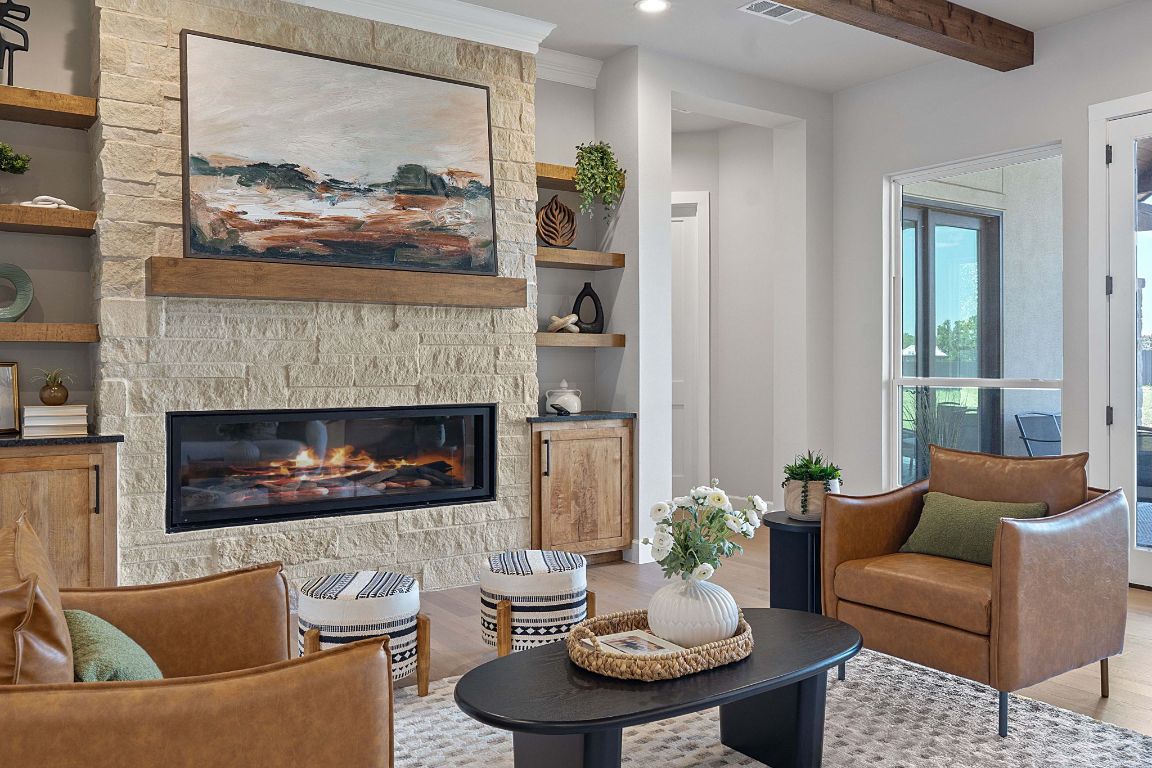 713 San Gabriel Ranch Road Liberty Hill, TX 78642 - Photo 1 of 40 a living room with furniture and a fireplace