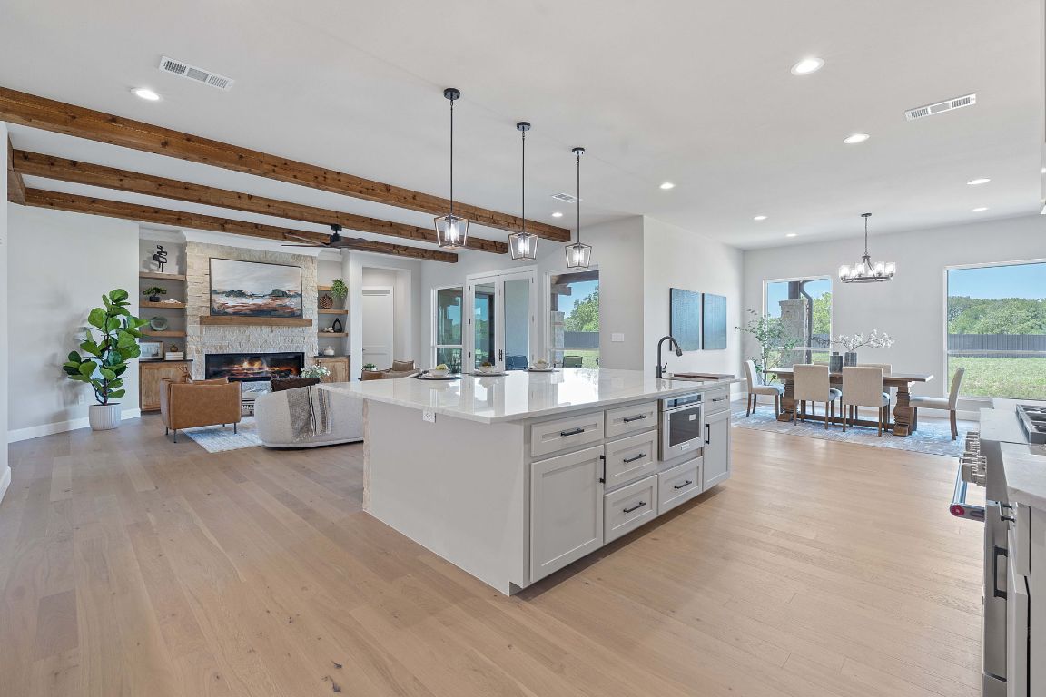 713 San Gabriel Ranch Road Liberty Hill, TX 78642 - Photo 12 of 40 a large living room with stainless steel appliances granite countertop furniture