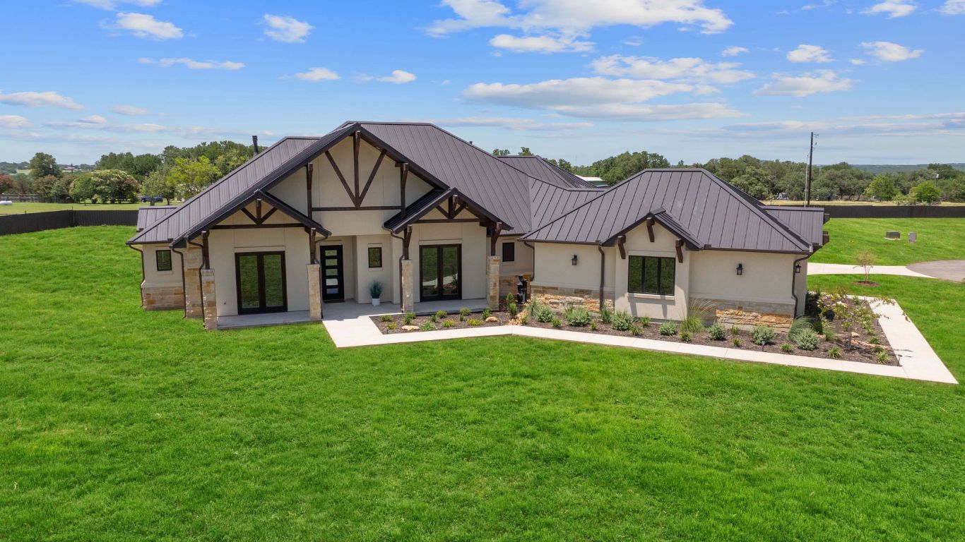 713 San Gabriel Ranch Road Liberty Hill, TX 78642 - Photo 3 of 40 a front view of house with yard and green space