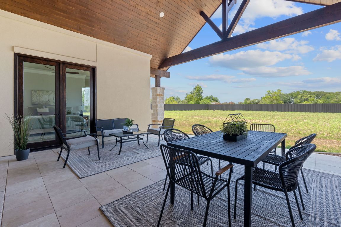713 San Gabriel Ranch Road Liberty Hill, TX 78642 - Photo 37 of 40 a view of a dining room with furniture window and wooden floor