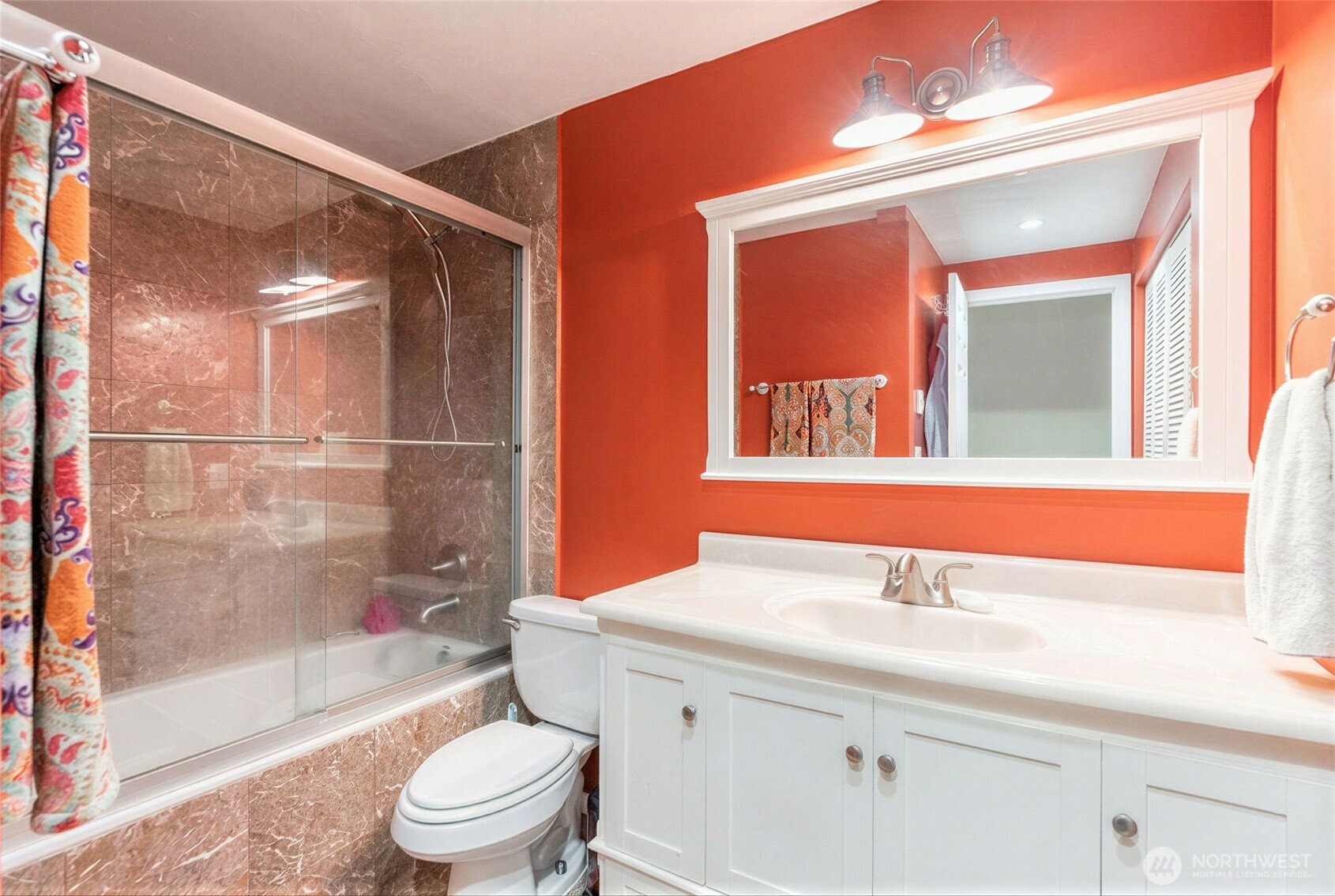 975 Aberdeen Avenue Northeast, Unit F207 Renton, WA 98056 - Photo 15 of 24 a bathroom with a sink a toilet and shower