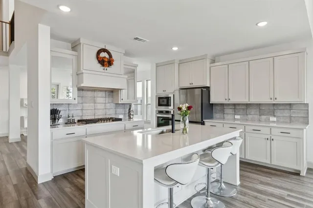 a view of kitchen island with furniture and wooden floor