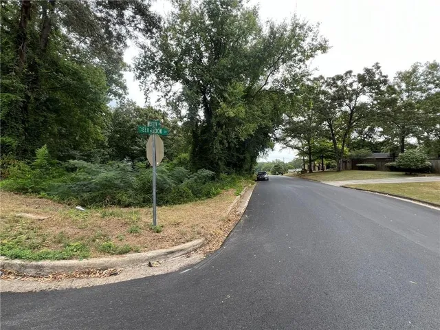 a view of a road with a view of the house