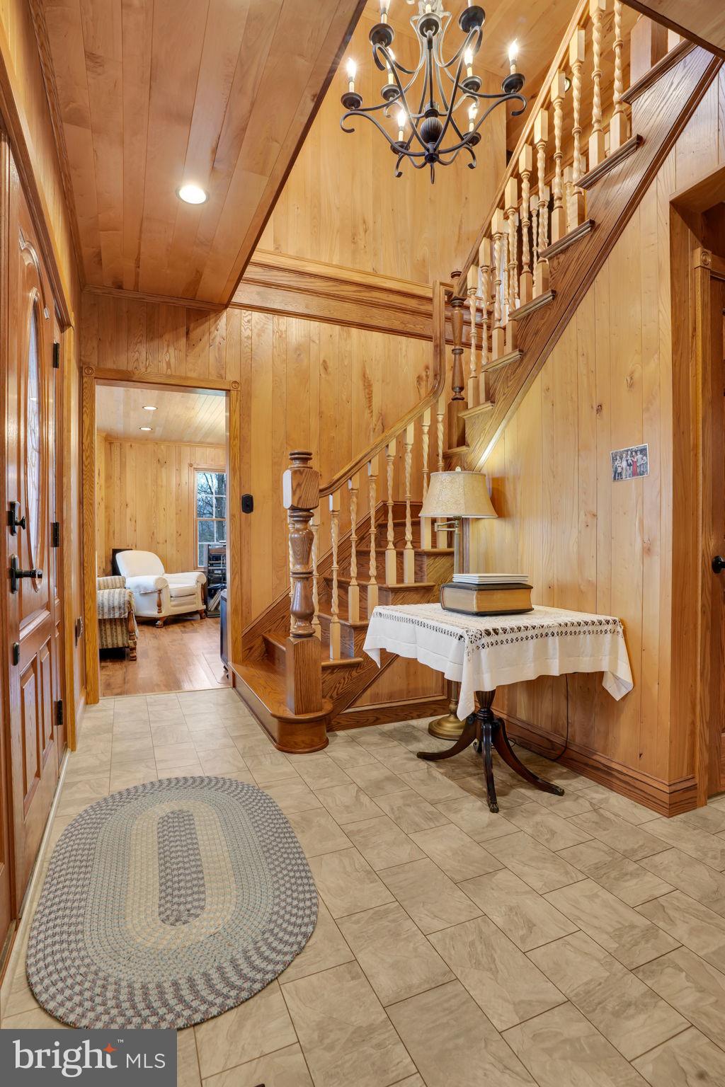 7848 Rte 104 Mount Pleasant Mills, PA 17853 - Photo 13 of 54 a view of hall way with furniture and couches with wooden floor