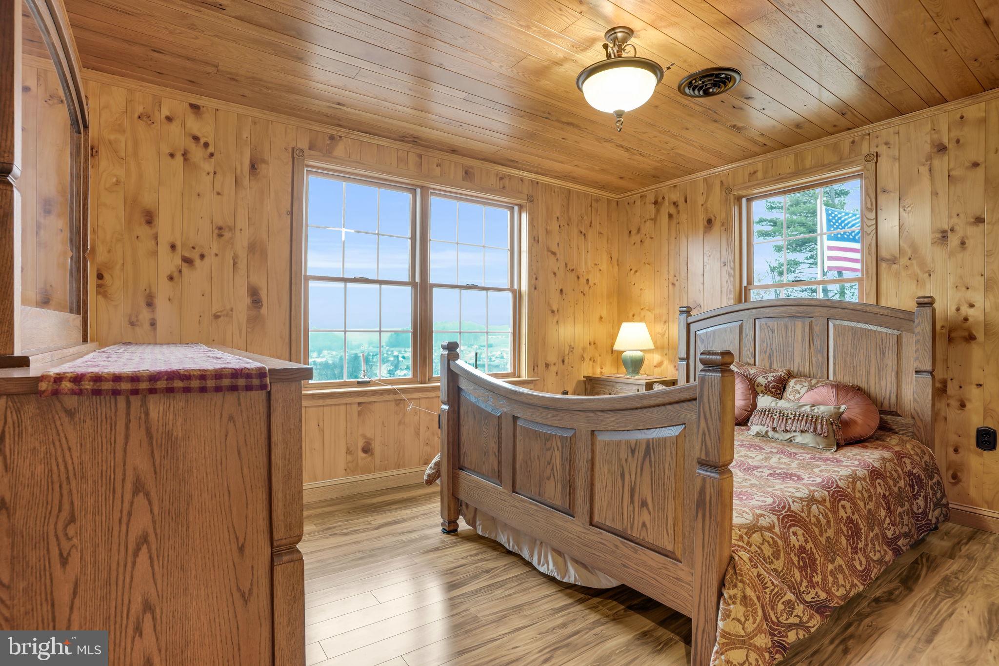 7848 Rte 104 Mount Pleasant Mills, PA 17853 - Photo 24 of 54 a view of a bedroom with wooden floor and furniture