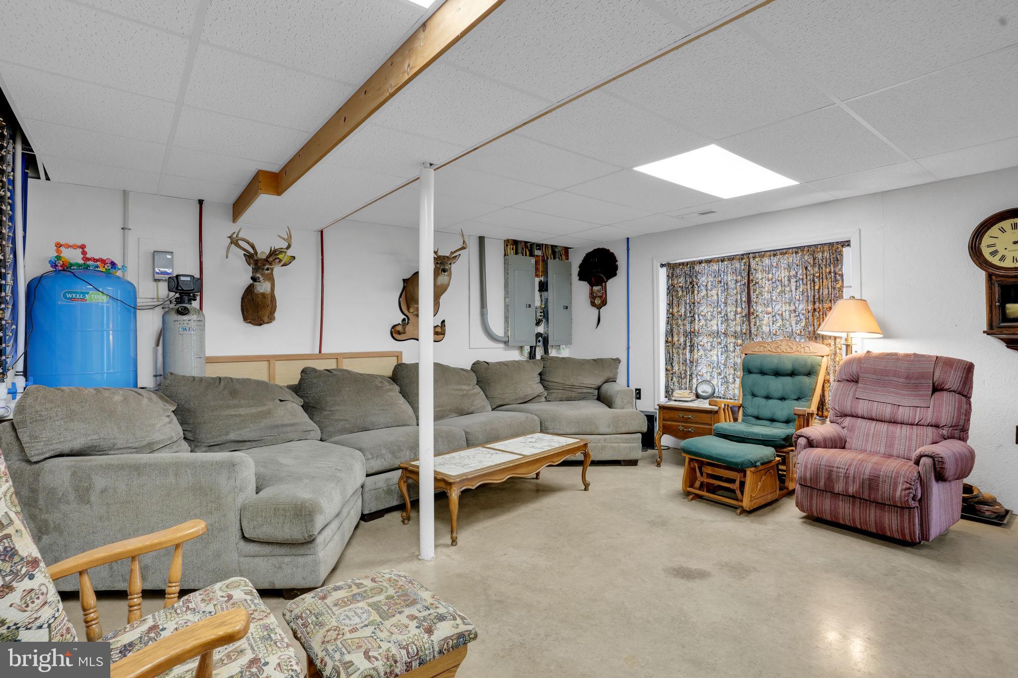 7848 Rte 104 Mount Pleasant Mills, PA 17853 - Photo 36 of 54 a living room with furniture and a large window