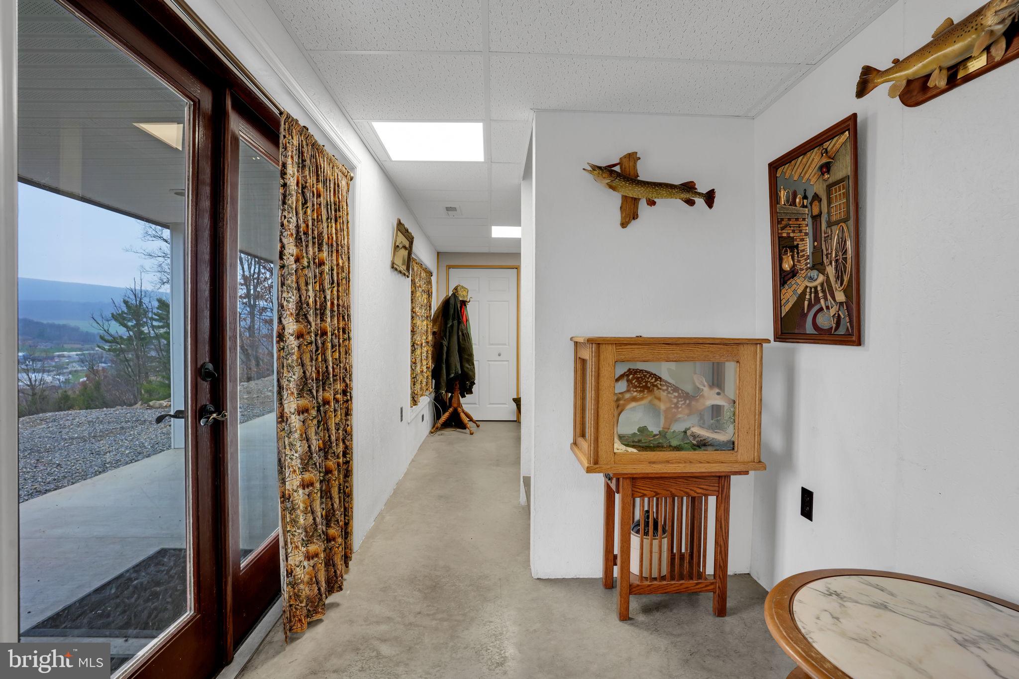 7848 Rte 104 Mount Pleasant Mills, PA 17853 - Photo 37 of 54 a view of a hallway with paintings on the wall